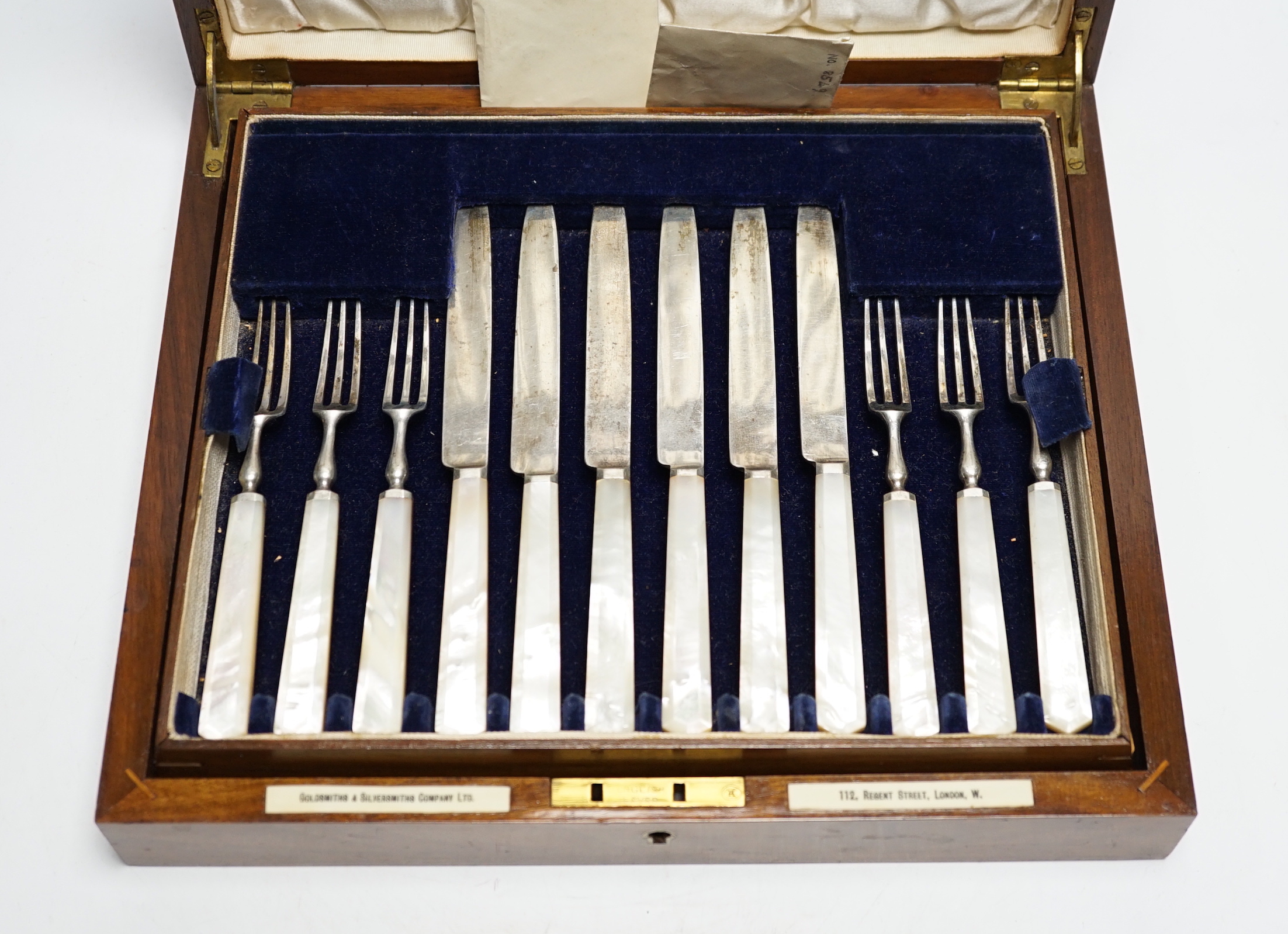A cased set of twelve pairs of George V mother of pearl handled silver dessert eaters, Goldsmiths & Silversmiths Co Ltd, Sheffield, 1934, knife 19cm.